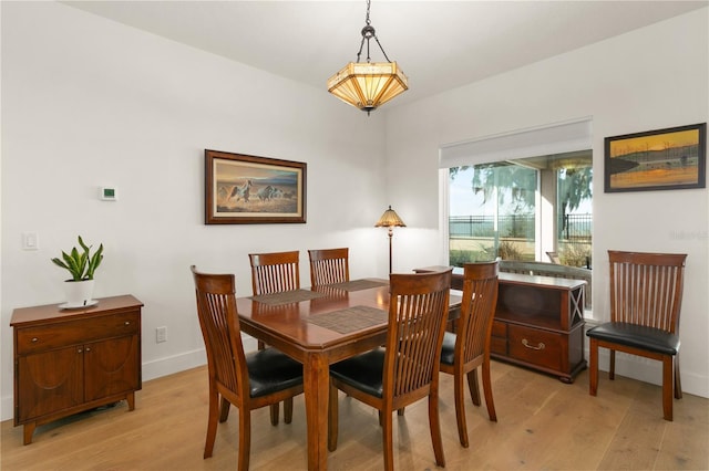 dining space featuring light hardwood / wood-style floors