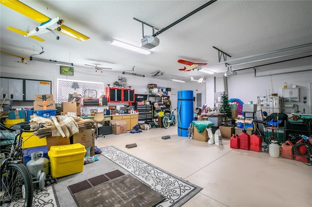 garage with electric panel, a garage door opener, and ceiling fan