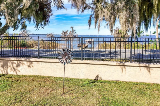 view of swimming pool featuring a water view