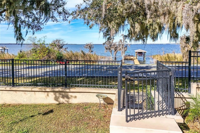 view of gate featuring a water view