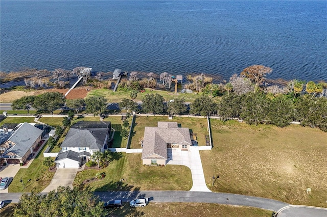 birds eye view of property with a water view