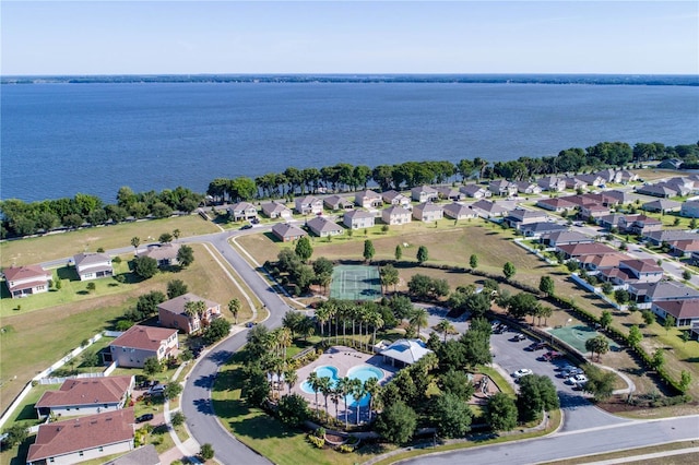 birds eye view of property with a water view