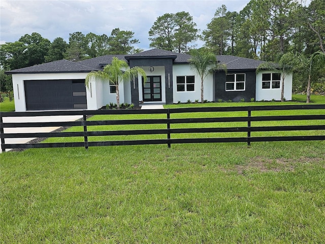 42157 Tamarac St, Eustis, FL 32736 - view of front facade with a garage, stucco siding, concrete driveway, and french doors