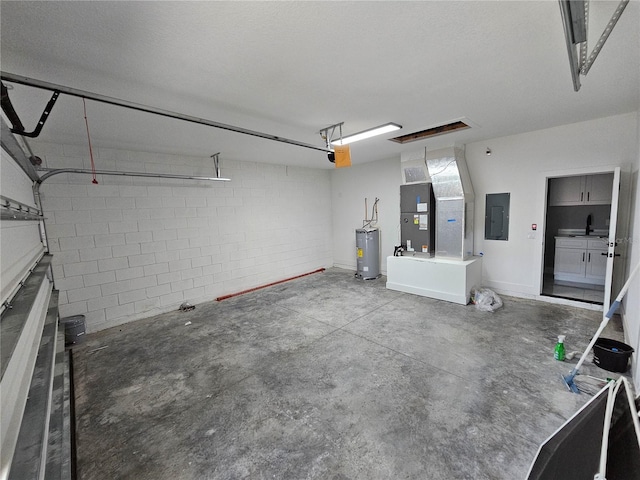 42157 Tamarac St, Eustis, FL 32736 - garage featuring electric panel, water heater, heating unit, and a sink