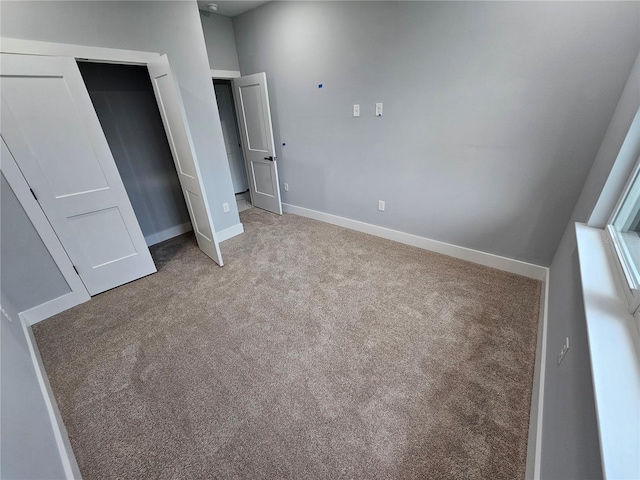 42157 Tamarac St, Eustis, FL 32736 - unfurnished bedroom with carpet, baseboards, and a closet