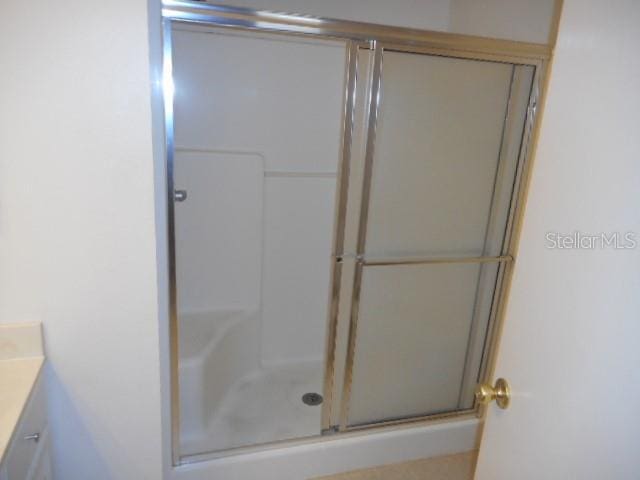 bathroom with vanity and an enclosed shower