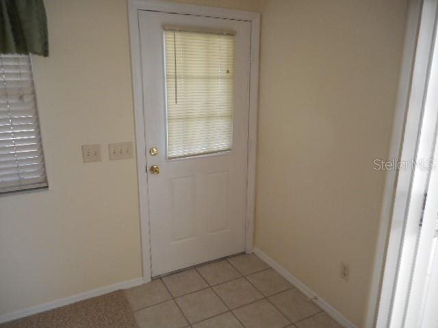 entryway featuring light tile patterned floors