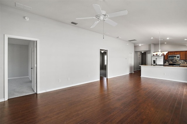 unfurnished living room with ceiling fan and dark hardwood / wood-style flooring