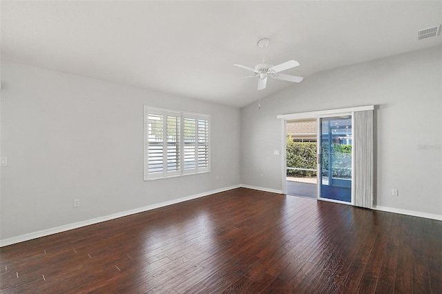 empty room featuring a healthy amount of sunlight, hardwood / wood-style flooring, ceiling fan, and lofted ceiling