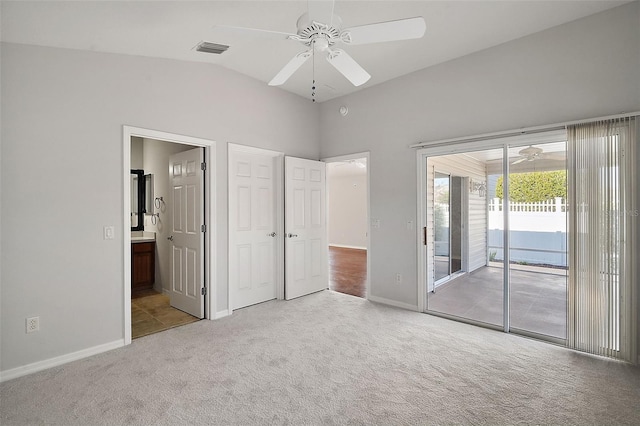 unfurnished bedroom featuring access to exterior, ensuite bathroom, light colored carpet, ceiling fan, and lofted ceiling