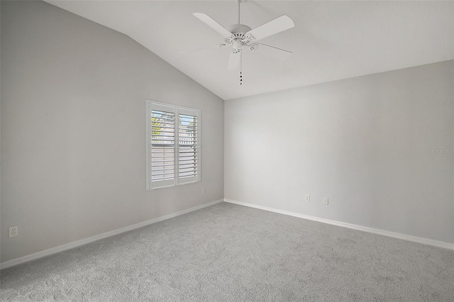 empty room with carpet, ceiling fan, and lofted ceiling