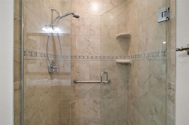 bathroom with a shower with shower door