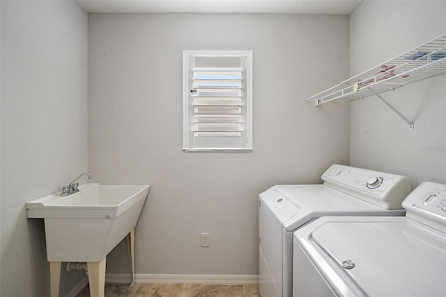 laundry area with washer and dryer and sink