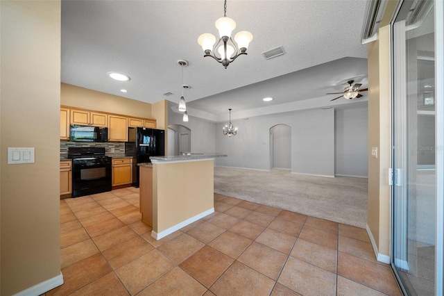 kitchen with arched walkways, black appliances, light carpet, and backsplash