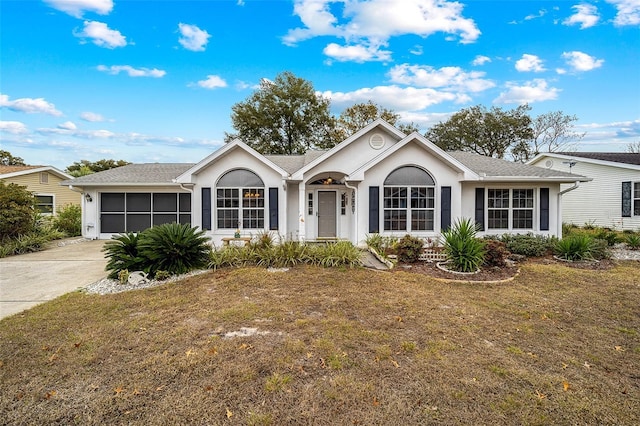 ranch-style house with a front lawn