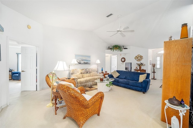 living room featuring light colored carpet, ceiling fan, and lofted ceiling