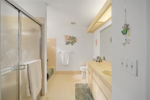 bathroom featuring toilet, an enclosed shower, and vanity