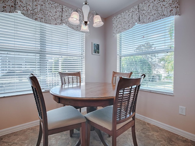 dining area with a notable chandelier