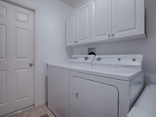 laundry area with cabinets and independent washer and dryer