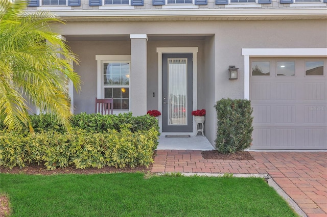 doorway to property with a garage