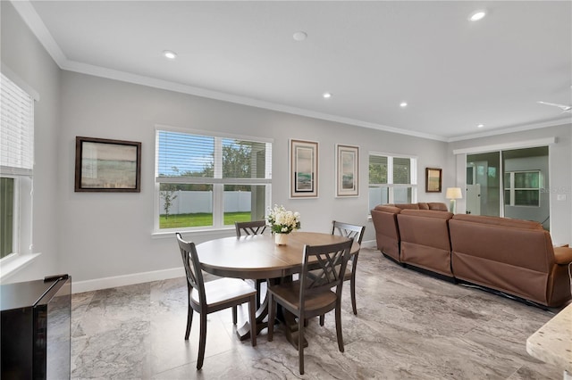 dining space featuring ornamental molding