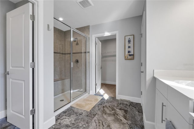 bathroom with vanity and walk in shower