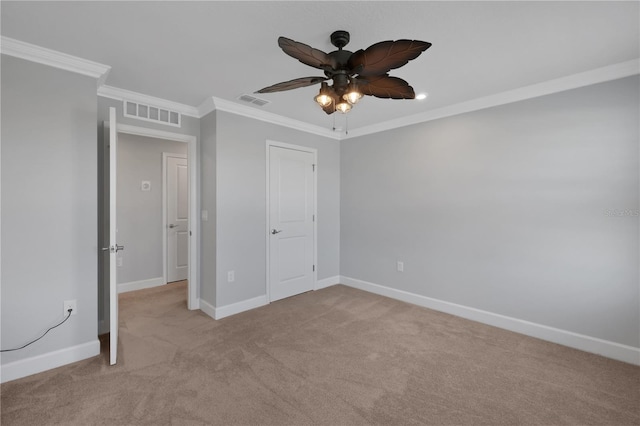 unfurnished bedroom featuring ceiling fan, ornamental molding, and light carpet