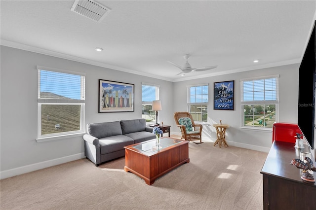 living room with ceiling fan, light colored carpet, and ornamental molding