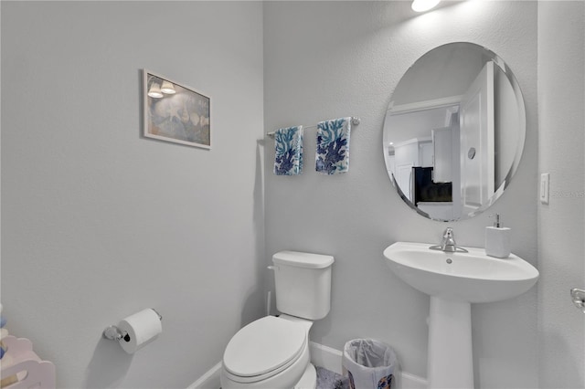 bathroom featuring toilet