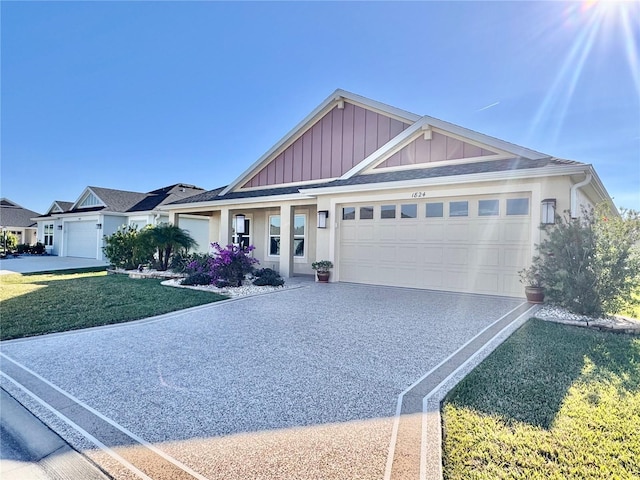 view of front of home featuring a garage and a front yard