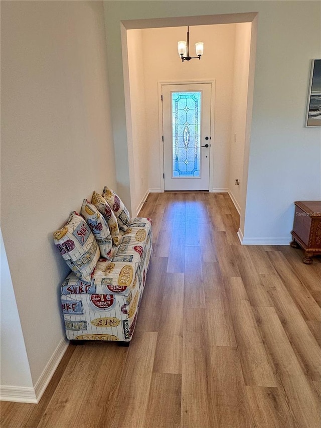 foyer with a chandelier and light hardwood / wood-style floors