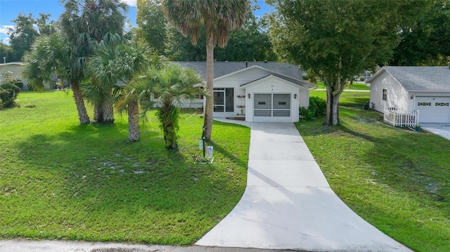 view of front of house featuring a front lawn and a garage