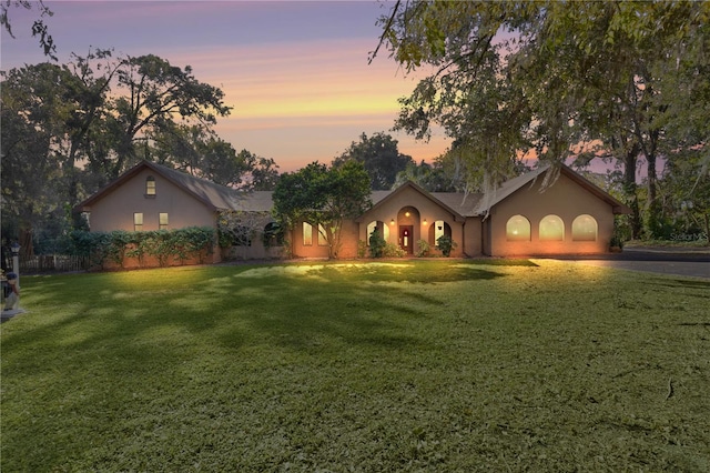 view of front of house with a yard