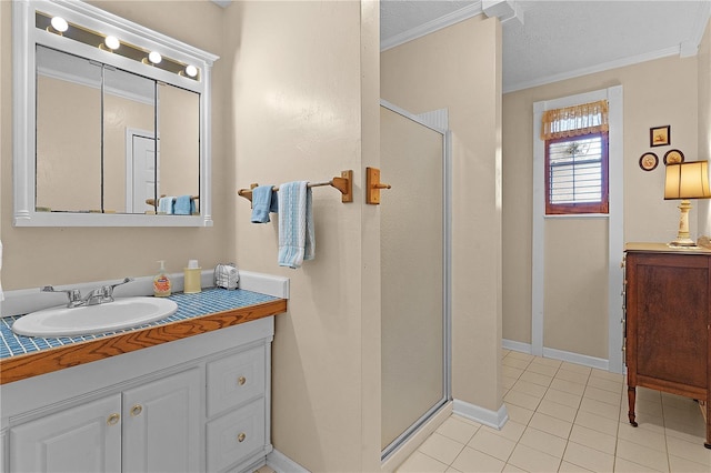 bathroom featuring tile patterned flooring, vanity, walk in shower, and ornamental molding