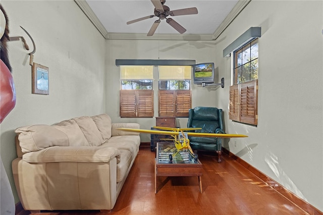 living room featuring crown molding, ceiling fan, and hardwood / wood-style flooring