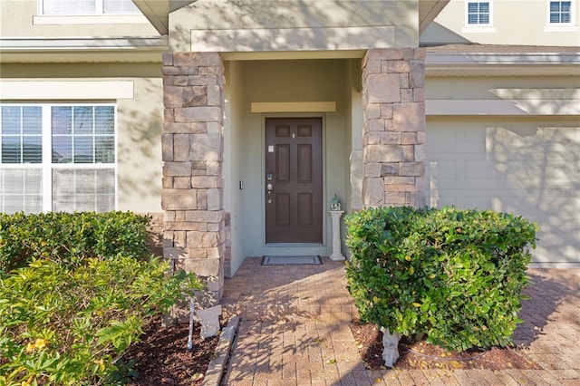 entrance to property featuring a garage