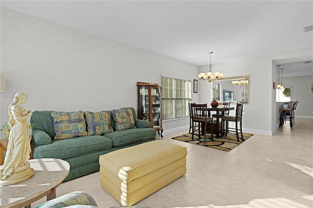 1741 Bonser Rd, Minneola, FL 34715 - living room with a chandelier and light tile patterned floors