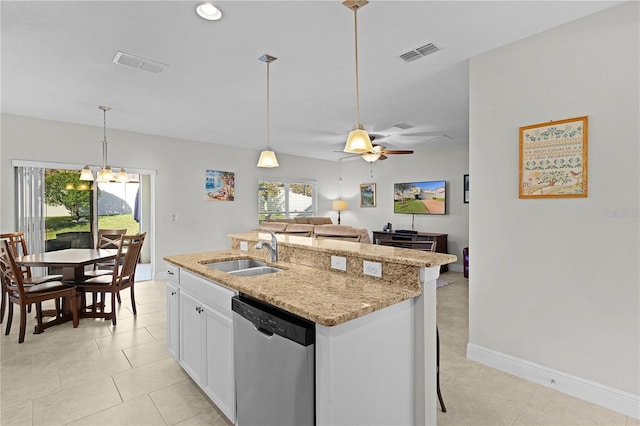 kitchen featuring dishwasher, white cabinets, a center island with sink, and sink