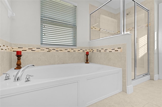 1741 Bonser Rd, Minneola, FL 34715 - bathroom featuring a bath, a shower stall, and tile patterned flooring
