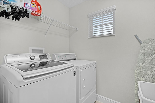 1741 Bonser Rd, Minneola, FL 34715 - laundry area featuring separate washer and dryer and baseboards