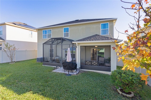 1741 Bonser Rd, Minneola, FL 34715 - back of house featuring stucco siding, a fenced backyard, a patio, glass enclosure, and roof with shingles
