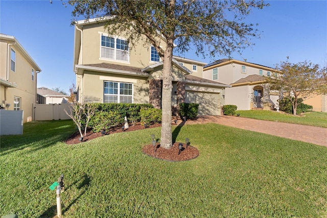 view of front facade with a front yard and a garage