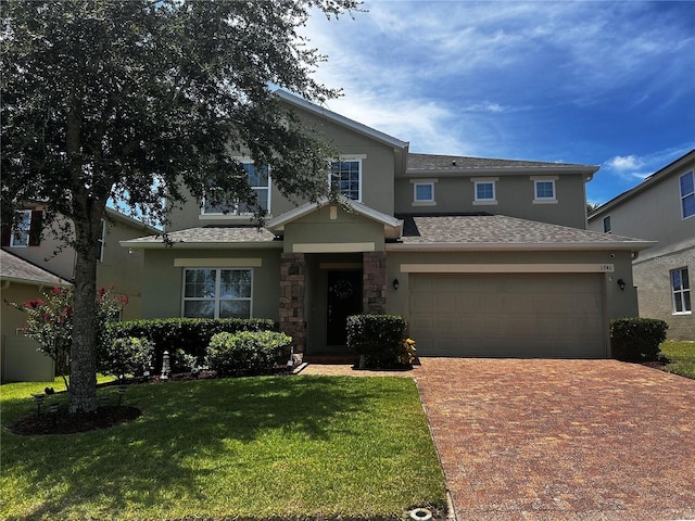 1741 Bonser Rd, Minneola, FL 34715 - view of front of house with stucco siding, driveway, an attached garage, and a front yard