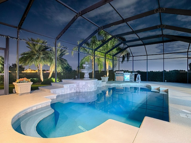 pool at dusk featuring a lanai, a jacuzzi, and a patio