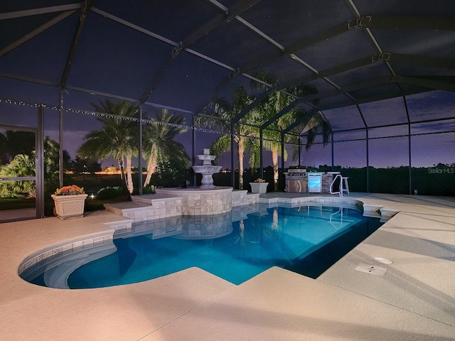 pool at dusk with a lanai, a patio area, and a grill