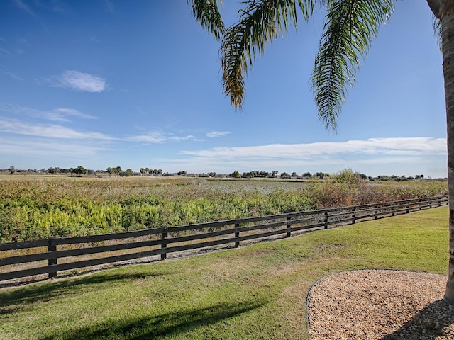 view of yard with a rural view