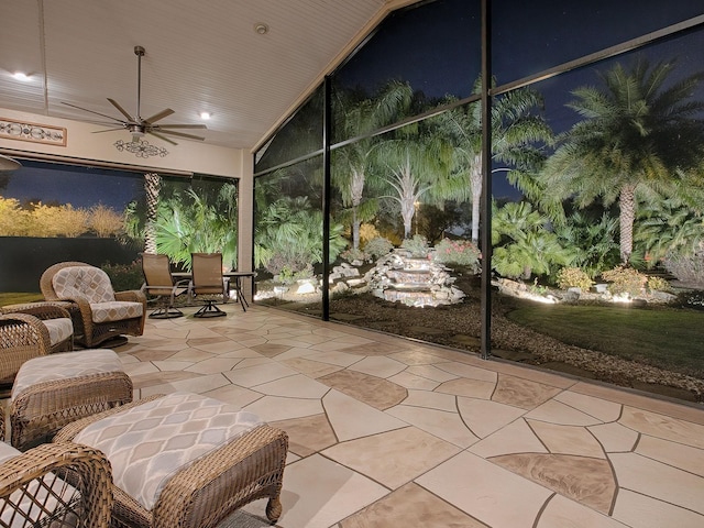 sunroom / solarium with ceiling fan and wooden ceiling