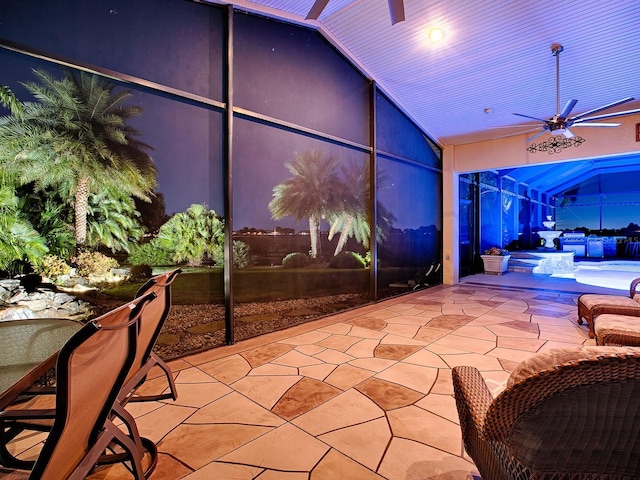 view of patio / terrace with ceiling fan and a pool