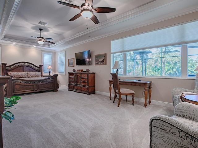 carpeted bedroom featuring a raised ceiling, ceiling fan, and crown molding