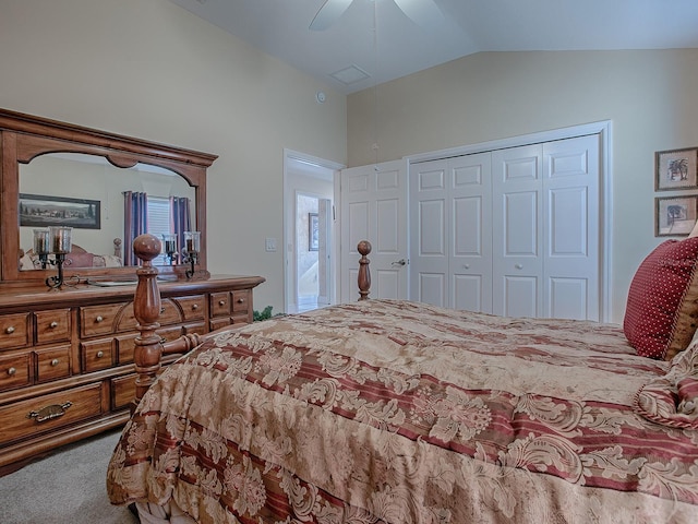 bedroom with ceiling fan, a closet, carpet floors, and lofted ceiling